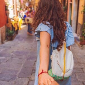 A woman holding her hand out to someone