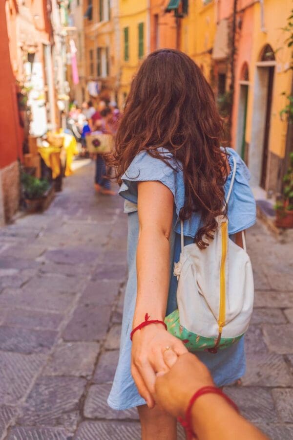 A woman holding her hand out to someone