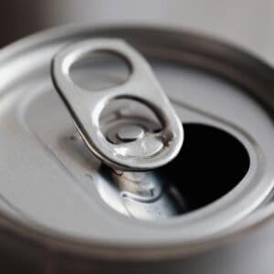 A close up of an opened can with the top open