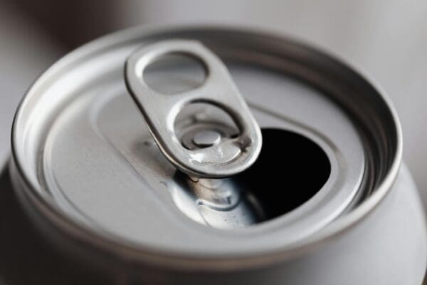 A close up of an opened can with the top open