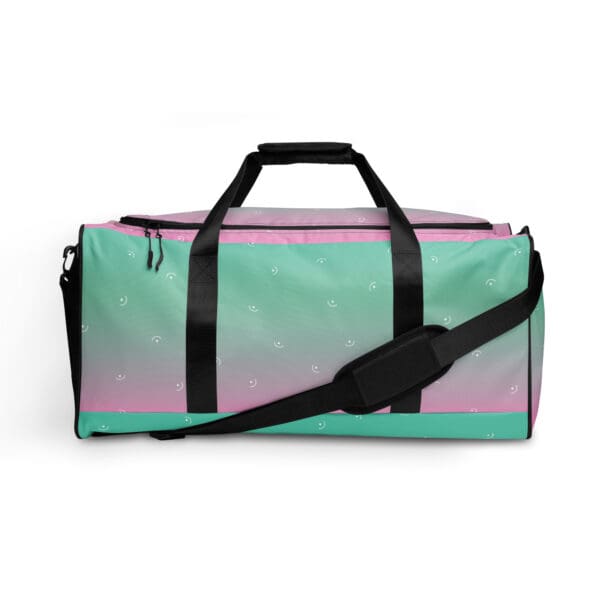 Pink and green duffel bag with smileys.