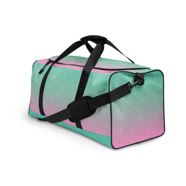 Pink and green patterned duffel bag.